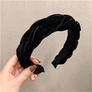 Detailed view of wide black velvet braided headband featuring thick French style texture