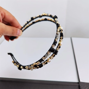 Close-up of double-layer headband with black crystals, gray beads and white pearls