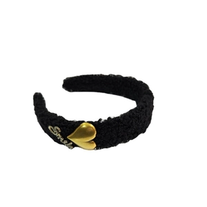 Fuzzy black fleece headband featuring a polished gold heart and crystal Smile lettering
