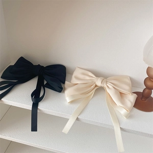 Elegant French style oversized satin bow hair clips with long ribbons in black and beige