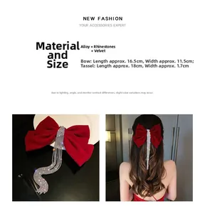Detail of red velvet bow hair clip with luxury rhinestone tassels for bridal hairstyle
