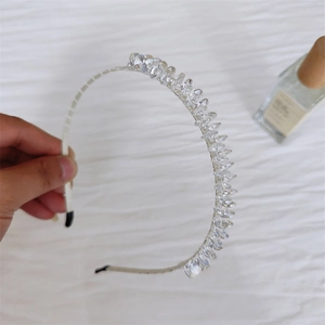 Close-up of elegant leaf crystal headband with shimmering multi-faceted clear beads