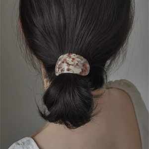 Elegant semi-round acetate hair tie with marble floral pattern for ponytails
