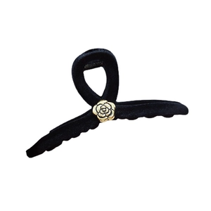 Elegant burgundy velvet hair claw clip with golden camellia flower accent for women