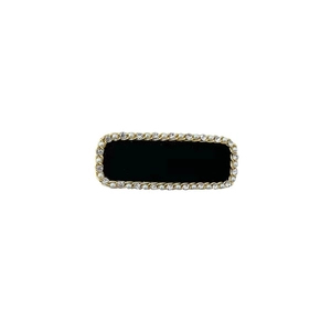 Barrette noire élégante avec bordure chaîne dorée, perles blanches et strass brillants
