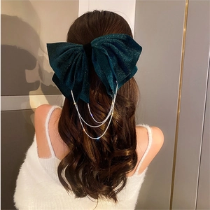 Elegant emerald green velvet bow hair clip with sparkling rhinestone fringe tassels