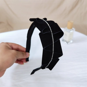 Elegant black velvet pleated headband decorated with sparkling white rhinestones