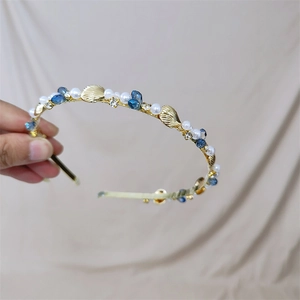 Golden shell headband with white pearls and navy blue beads for a summer ocean style