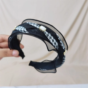 Retro wide headband with houndstooth ribbon and crystal embellishments on black fabric