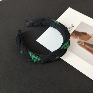Braided wide headband featuring green houndstooth pattern and black pleated fabric contrast