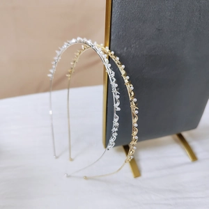 Elegant thin metal headband set with white pearls and celestial star moon elements