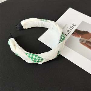 Chic green and white houndstooth fabric headband with intertwined twist design for women