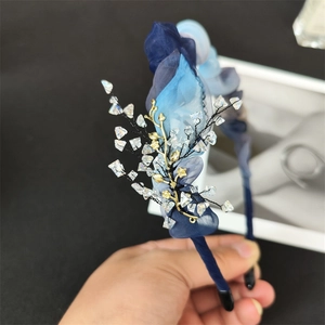 Elegant blue organza headband featuring golden metallic branches and crystal beads