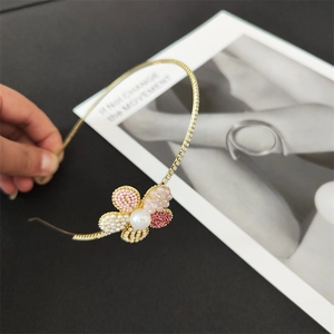 Eleganter goldener Metall-Haarreif mit rosa Kristallblumen und großer Perle für Damen