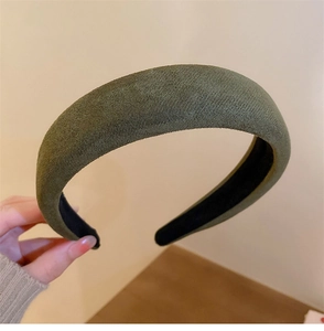 Close-up of vintage dark green velvet wide headband with soft matte sponge padding
