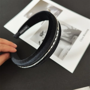 Detail view of handmade black sponge headband with sparkling square crystal embellishments