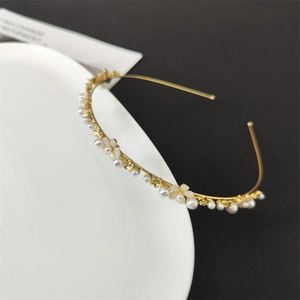 Elegant floral leaf headband with white pearls and cat eye stones on gold metal base