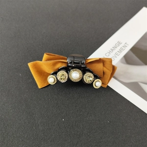 Baroque style velvet bow hair claw clip with pearls and rhinestones in mustard yellow
