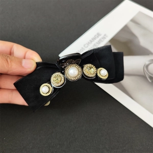 Baroque velvet shark clip with pearls and rhinestones on a black satin bow