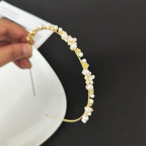 Elegant gold headband with white faux pearls and delicate cream flowers for weddings
