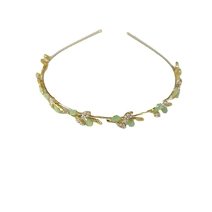 Elegant gold flower and leaf headband with light green stones and white pearls
