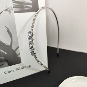 Sparkling silver thin headband with micro rhinestones and five heart shaped zirconia stones