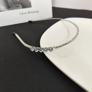 Elegant silver thin headband featuring sparkling rhinestones and heart-shaped crystals