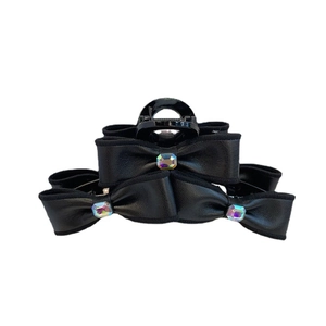 Oversized black faux leather bow hair claw clip with colorful square rhinestones