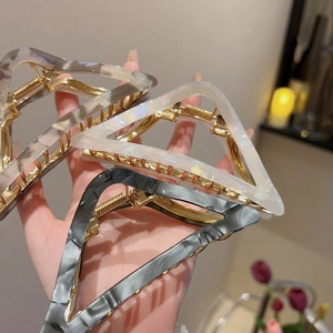 Set of three large acetate triangle hair claws with marble patterns in grey and white