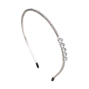 Sparkling rhinestone headband with heart-shaped cubic zirconia on silver metal frame