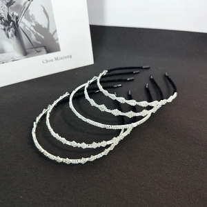 Detailed macro view of five silver alloy headbands with sparkling zircon inlay and protectors