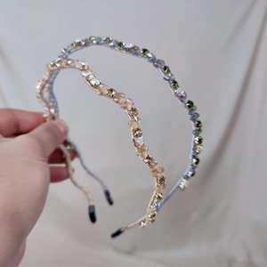 Detail shot of two handmade crystal headbands with sparkling beads and protective ends