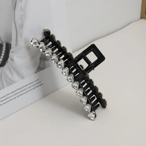 Elegant large black hair claw clip with heart shaped rhinestones and metal spring