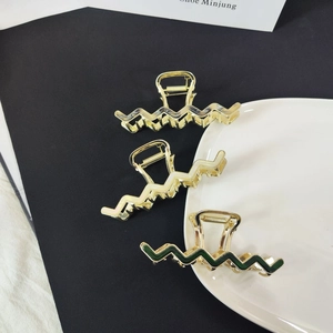 Three zigzag metallic claw clips with gold plating and colorful acetate resin inserts