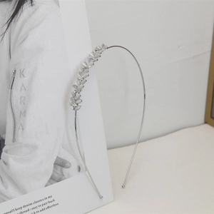 Minimalist silver metal headband featuring grey cat-eye stone leaves and sparkling rhinestones