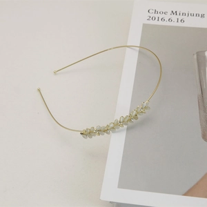 Elegant gold headband with cat eye stone leaf and rhinestones for minimalist hair styling