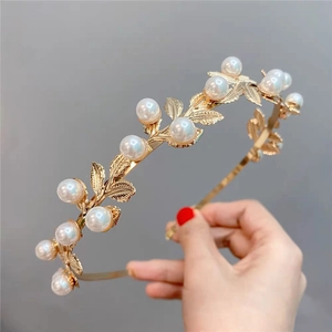 Baroque gold leaf headband with elegant white pearls for bridal and party hair styling