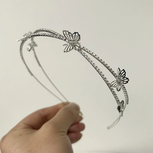 Silver double-layer headband featuring hollow butterfly designs and shimmering rhinestones