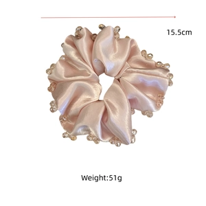 Pink satin scrunchie with crystal beads, 15.5cm diameter and 51g weight detail view