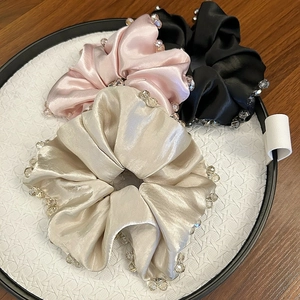 Luxurious satin silk scrunchies with crystal beads in pink, champagne, and black