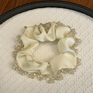 Elegant champagne satin scrunchie with sparkling clear beaded edge for women's hair