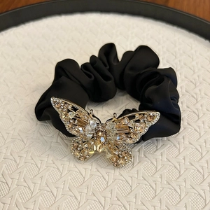 Elegant black silk scrunchie with crystal butterfly ornament for high ponytails