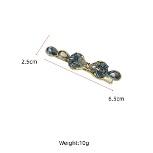 Detail view showing dimensions of high-end crystal bow hairpin with gold metal base