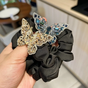 Elegant crystal butterfly scrunchies set with sparkling rhinestones and black satin fabric