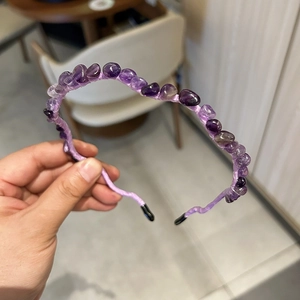 Detail of purple crystal stone beaded headband with elegant woven fabric finish