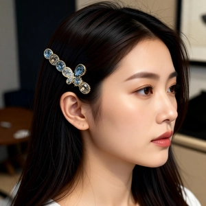 Blue crystal butterfly hair clip worn by model showing elegant side view and luxury shine