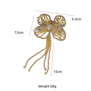 Detailed view of handmade beaded butterfly hair clip with long crystal tassels and size specs