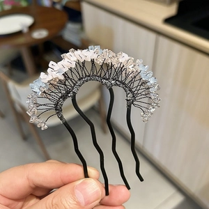Handmade Hanfu hair comb with light pink and blue crystals on a black metal base
