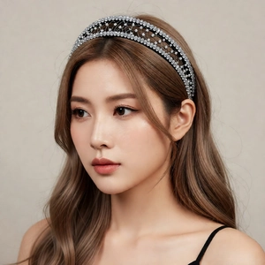 Elegant wide headband with silver crystal mesh and black fabric on female model