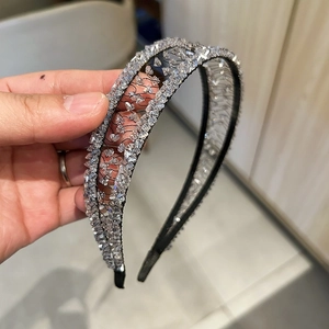 Sparkling crystal padded headband with hollow weave and handmade floral diamond details
